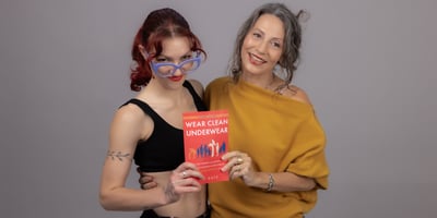 Ali Photo with Kaia and WCU Book-1